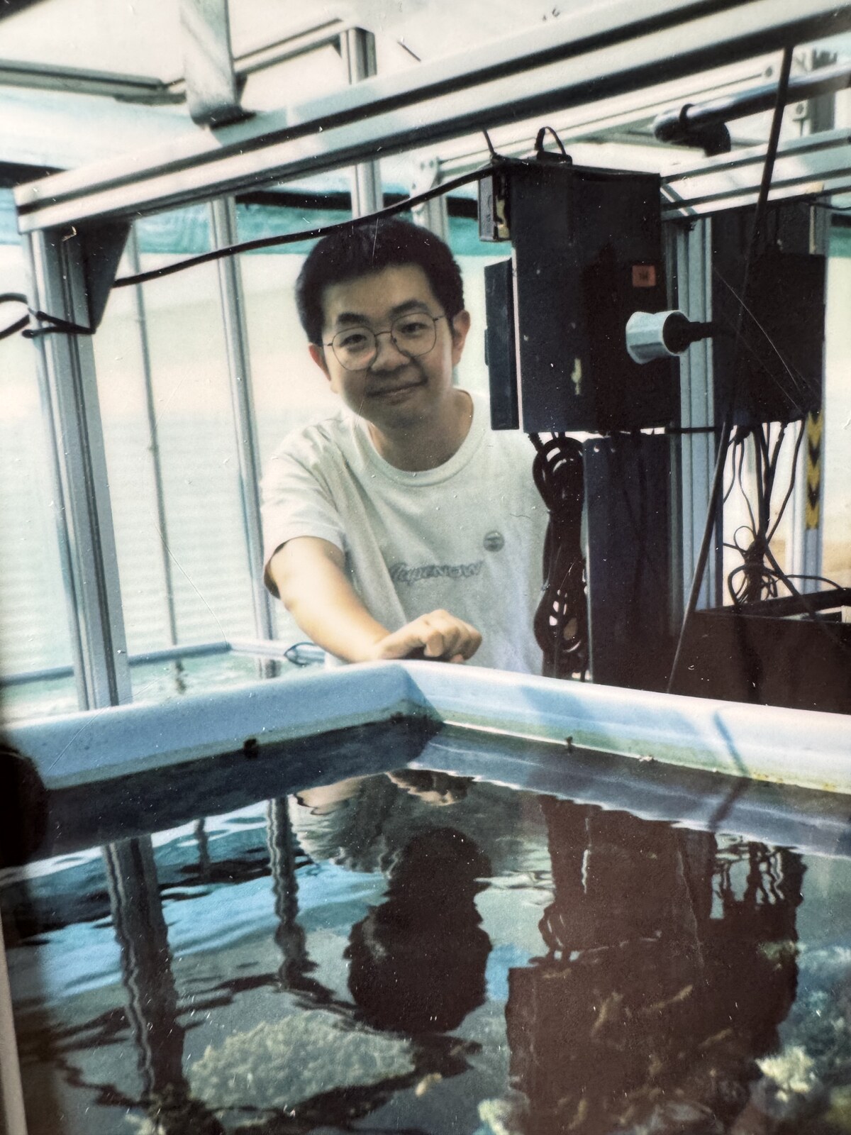 Kaizhang Kang caring for corals during research in Saudi Arabia